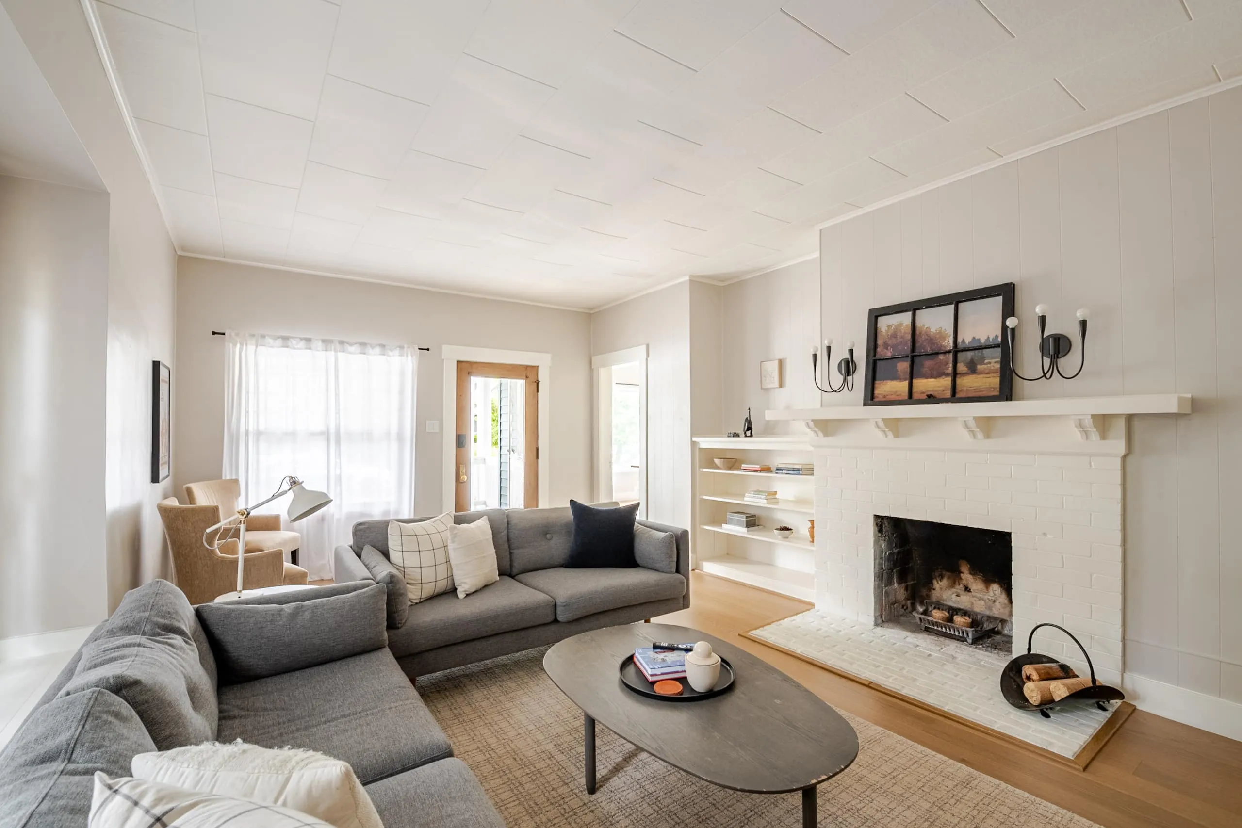 Manito Bungalow living room — gas fireplace and deep sectionals